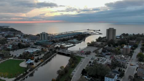 Sunrise-drone-shot-circling-around-a-Mississauga-harbor