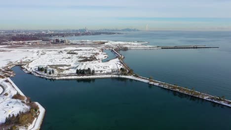 Drone-flying-up-from-the-frozen-lakeshore-of-Mississauga