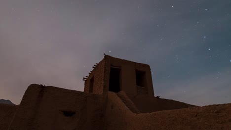 Moon-light-reflection-on-clay-mud-brick-adobe-handmade-wall-of-a-traditional-local-nomad-native-people-in-rural-night-area-district-in-central-desert-in-Iran-abandoned-settlement-house-star-in-the-sky