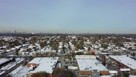 Drone-flying-over-snow-covered-Mississauga-neighborhood-in-winter
