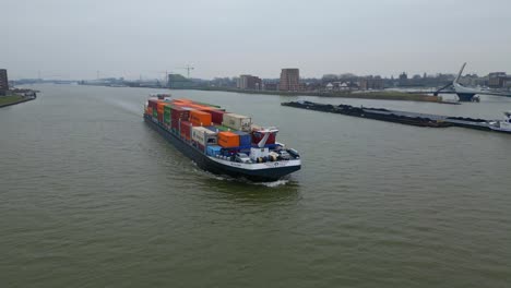 Scaldis-Container-Ship-Approaching-Along-Oude-Maas-On-Overcast-Day-In-Dordrecht-Passing-Another-Vessel
