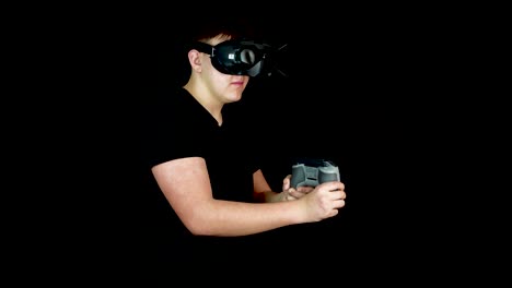 Young-Man-Playing-Action-Video-Game-in-Virtual-Reality,-Wearing-VR-Goggles-and-Holding-Controller