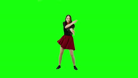 Eine-Junge-Frau-Im-Roten-Kleid-Tanzt-Auf-Einem-Grünen-Hintergrund