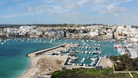 Marsaxlokk-Fishing-Village-In-Malta-Island-In-Summer---aerial-drone-shot