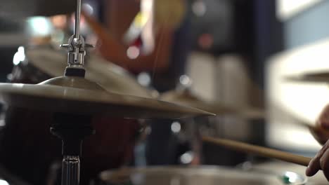 Drummer-and-band-at-concert,-close-up-view-of-drum-plate