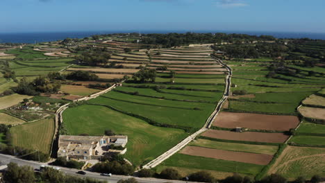 Aerial-Vista-Of-Green-Fields-In-The-Countryside-Of-Marsaxlokk-In-The-South-Eastern-Region-of-Malta