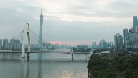 Guangzhou-downtown-with-Liede-bridge,-Canton-tower-on-a-cloudy-evening