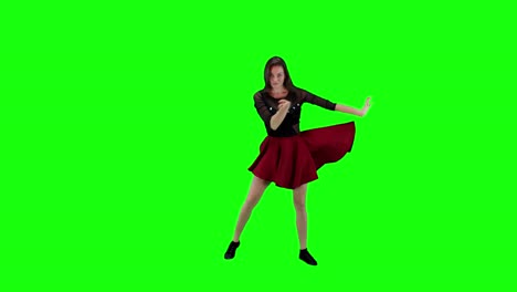 A-young-woman-dancing-on-a-green-screen-background