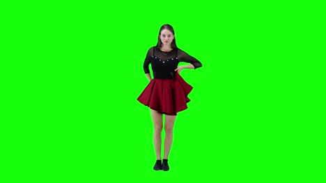 Attractive-female-dancer-in-red-dress-dancing-in-front-of-a-green-screen