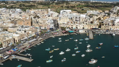 Aerial-View-Over-Fishing-Village-Of-Marsaxlokk-In-Malta---drone-shot