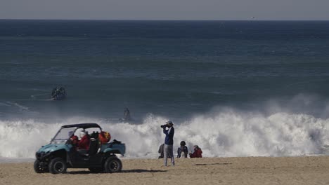 A-coastguard-in-dune-buggy-passes-the-tourist-photographer-who-takes-their-picture