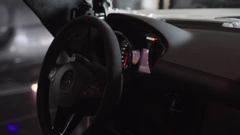 Slow-motion-interior-shot-of-the-steering-wheel-and-dashboard-of-a-Mercedes-car