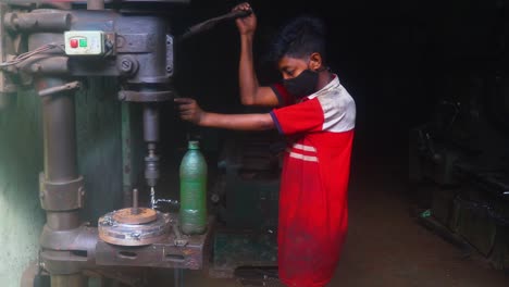 Innocent-Indian-child-working-machine-drill-press,-Childhood-slave-labour-industry