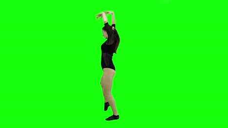 Side-view-of-a-beautiful-model-dancing-in-front-of-a-green-screen