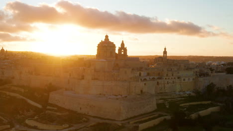 Sunset-Scenery-On-The-Historic-Walled-City-Of-Mdina-In-Malta---aerial-drone-shot