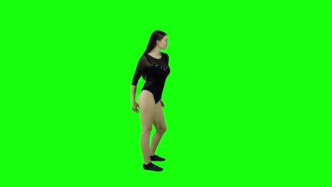 Side-view-of-a-female-dancer-in-leotard-dancing-in-front-of-a-green-screen