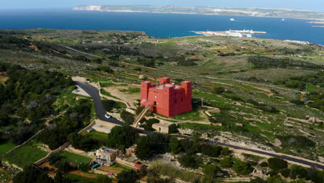 Aerial-View-Of-The-Red-Tower-In-MellieÄ§a,-Malta---drone-shot