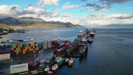 Aerial-Drone-Fly-Above-Sea-Port-in-Ushuaia-Argentina-Ships-Docked-Containers-in-Water-Transportation-Antarctic-Navigation-Route