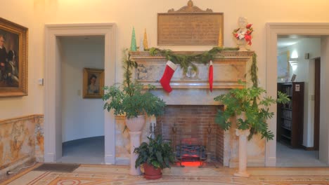 Entrance-Hall-Of-Howard-Whittemore-Library-With-Christmas-Decorations-And-Indoor-Plants-In-Naugatuck,-Connecticut,-USA