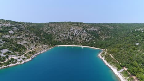 Natural-Blue-Water-Bay-Beach-Coast-Scenic-Aerial-Above-Rakalj-Pula-Sea-Croatia,-Travel-and-Tourism-Concept-in-Croatian-Summer-Vibes