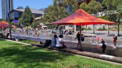 Sydney's-bustling-Darling-Quarter-and-Harbour-features,-among-others,-this-well-loved-playground-and-fountain-park-near-the-National-Maritime-Museum,-where-families-converge-in-carefree-merriment