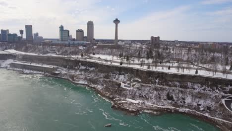 Slow-aerial-pan-of-Niagara-Falls-skyline-and-Skylon-Tower-in-winter