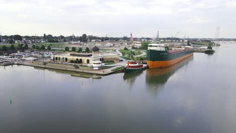 Industrial-vessel-moored-near-the-National-Museum-of-the-Great-Lakes-in-Toledo,-aerial-drone-view