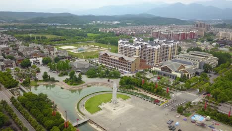 Aerial-shot-of-central-square-being-rebuilt-in-Lidung-County,-Sichuan-Province,-China,-after-the-earthquake