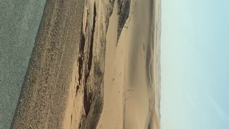 Vertical-Desert-Landscape-Passing-By-From-Car-Passenger-POV