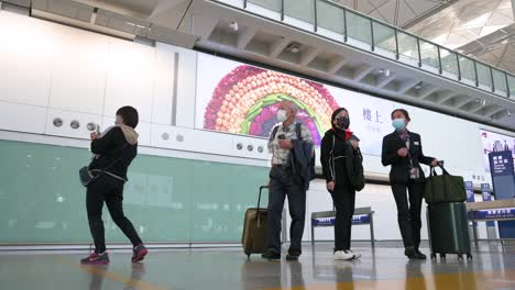 Flight-passengers-are-seen-at-the-arrival-hall-after-landing-in-Hong-Kong's-Chek-Lap-Kok-international-airport