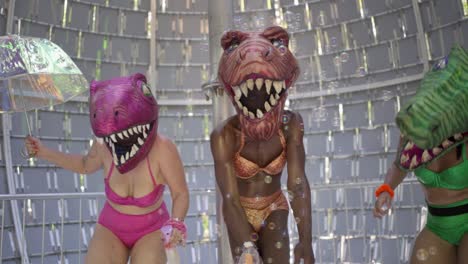 Performers-with-dinosaur-head-costumes-performing-and-dancing