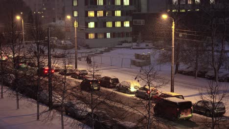 Urban-City-Streets-of-Riga,-Latvia-during-Winter-Snow-Blizzard-at-Night