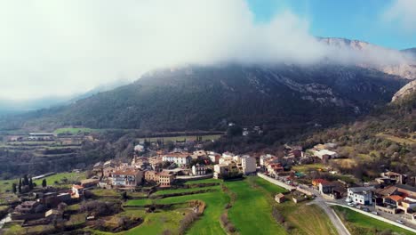 Beautiful-aerial-zoom-out-view-of-the-village-of-Peramola,-in-Lleida,-Catalonia,-Spain