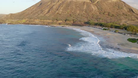 Koko-head-Sandy-beach-Oahu-Hawaii-aerial-pullback-reveal-rolling-waves