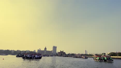 A-beautiful-shot-of-the-boats-docked-in-the-sea-which-over-looks-the-Taj-Mahal-hotel-and-Gate-way-of-India