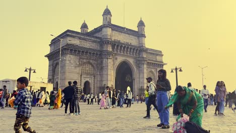 A-side-angle-shot-of-the-Gate-way-of-India-where-we-can-see-visitors-enjoying-the-greatness-of-the-structure