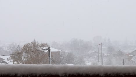 Heavy-snowfall-on-electric-poles-and-wires-in-a-town