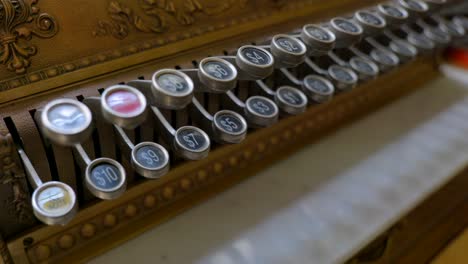 The-keys-or-latches-of-an-antique-cash-register