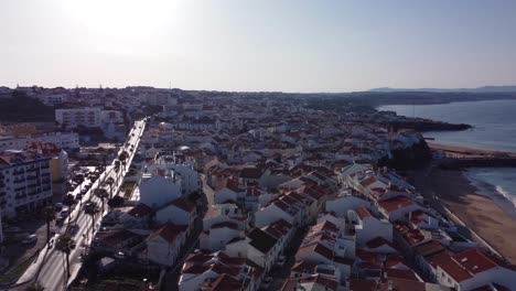 Aerial-pullback-from-Ericeira-Downtown-revealing-scenic-Atlantic-Coastline