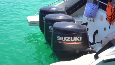 3-suzuki-outboard-engines-attached-to-rear-of-speedboat