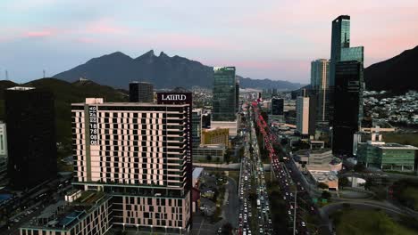 Aerial-view-towards-the-Latitud-condo,-colorful-evening-in-Monterrey,-Mexico