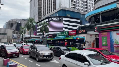 Panning-view-of-the-scene-of-the-street-with-congested-traffic-along-Bukit-Bintang,-Kuala-Lumpur,-Malaysia