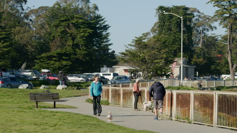 People-walking-along-path-in-Santa-Cruz,-California