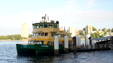 Passengers-embark-and-disembark-a-Sydney-ferry-in-Sydney-Harbour-Australia