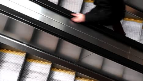 Background-of-escalator-moving-up-and-down-from-above,-top-down-shot-of-a-escalator-with-handrails-backdrop,-seamless-loop