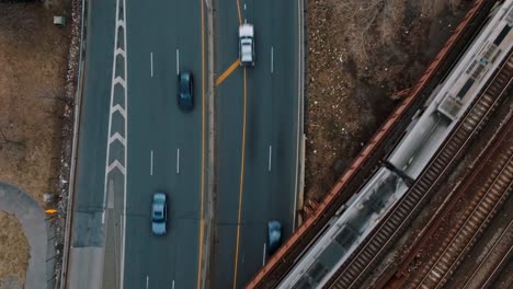 Hovering-shots,-static,-of-highway,-cars-and-trains-in-New-York-City,-day,-4K-drone