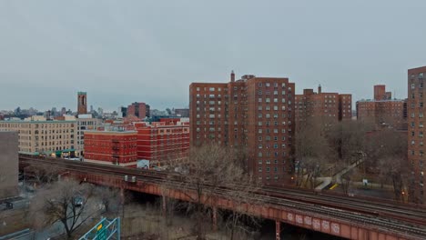 Swooping-shot-over-highways-and-buildings-in-New-York-City-residential,-day,-4K-drone