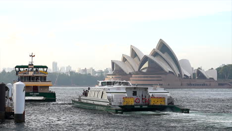 A-ferry-approaches-a-wharf-ready-for-passengers-to-embark,-in-Sydney-Harbour-Australia