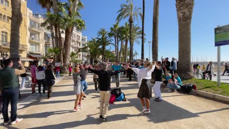 Sardana-dance-in-Catalonia-typical-cultural-historical-folk-dance-in-the-square-of-Sitges-with-live-music