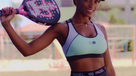 Slow-motion-tilt-down-revealing-sexy-athletic-body-of-black-woman-showing-her-padel-outfit